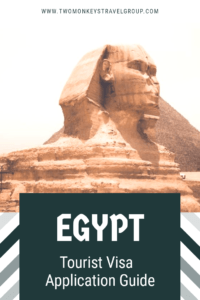 Sphinx statue beside an Egyptian pyramid