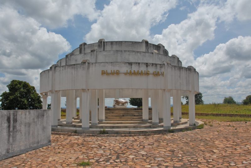 A small ancient building under cloudy skies