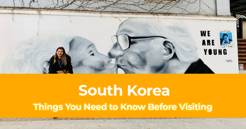 A wall painting of an old couple kissing