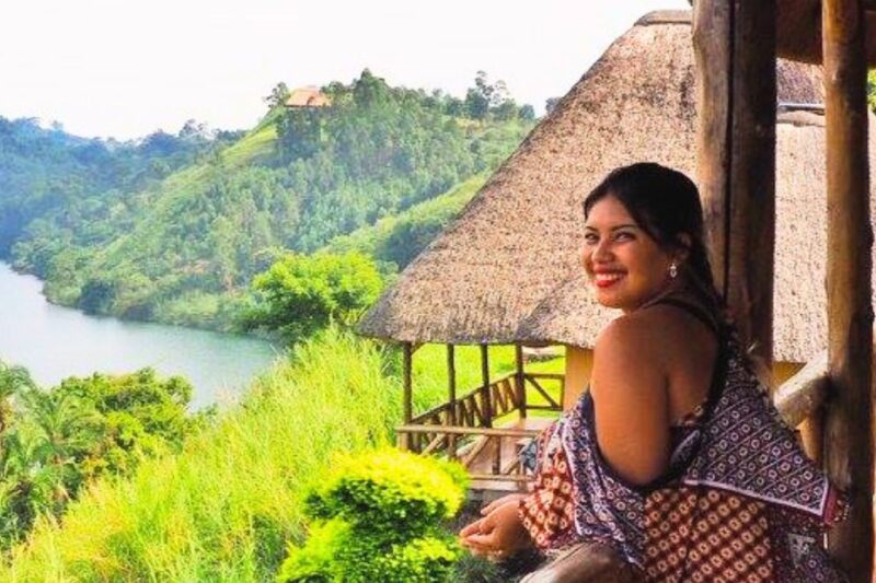 Girl smiling at camera while standing at a balcony