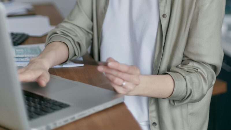 Woman typing something on her laptop