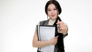 Girl holding out her hand in a heart symbol