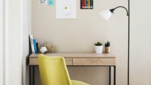 An office at home with yellow chair and wooden table