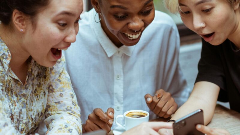 friends in shock looking at the phone