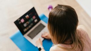 Woman working on her laptop on the floor