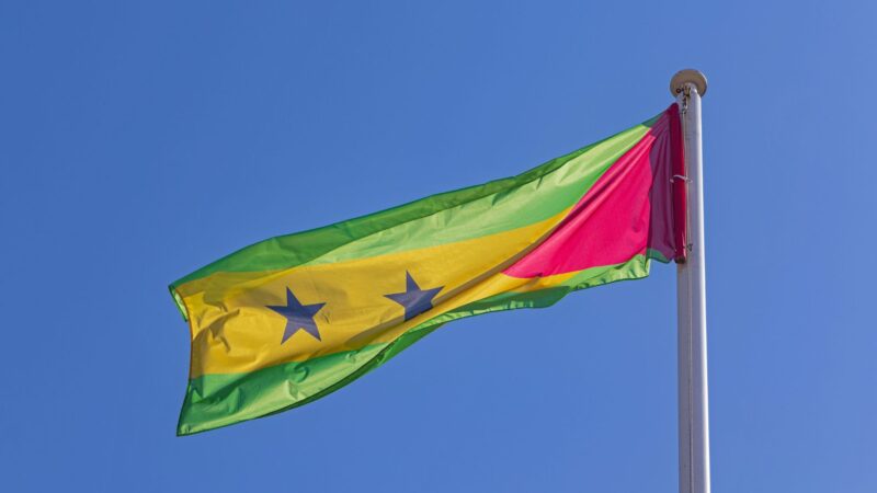 The flag of São Tomé & Principe high on a pole