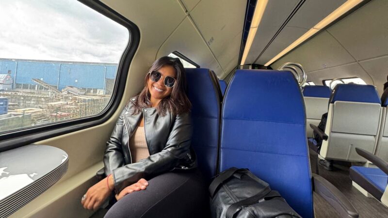 Woman taking a selfie at a train station