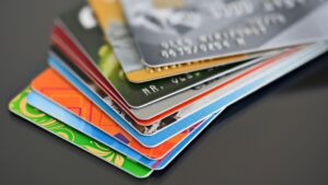 A couple of credit cards spread out on a table