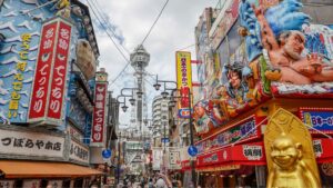 Japanese street with shops and tall tower
