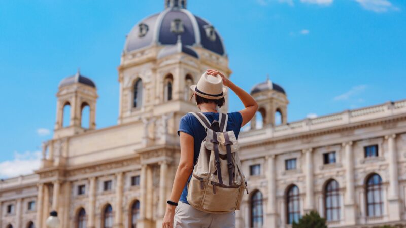 A girl wearing a hat and backpack